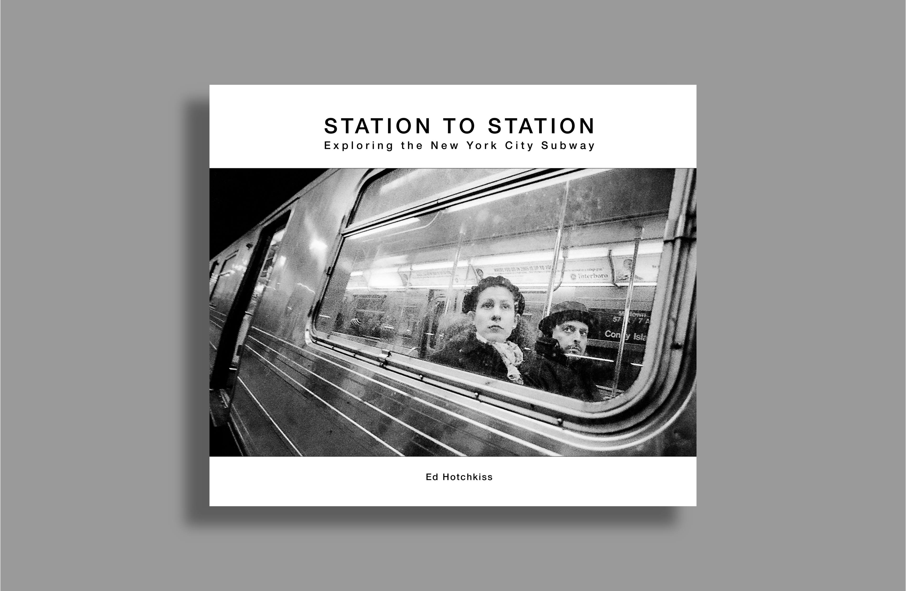 Cover of Station to Station, depicting a woman and man sitting inside a subway car photographed from outside the car. The woman has a melancholy expression.