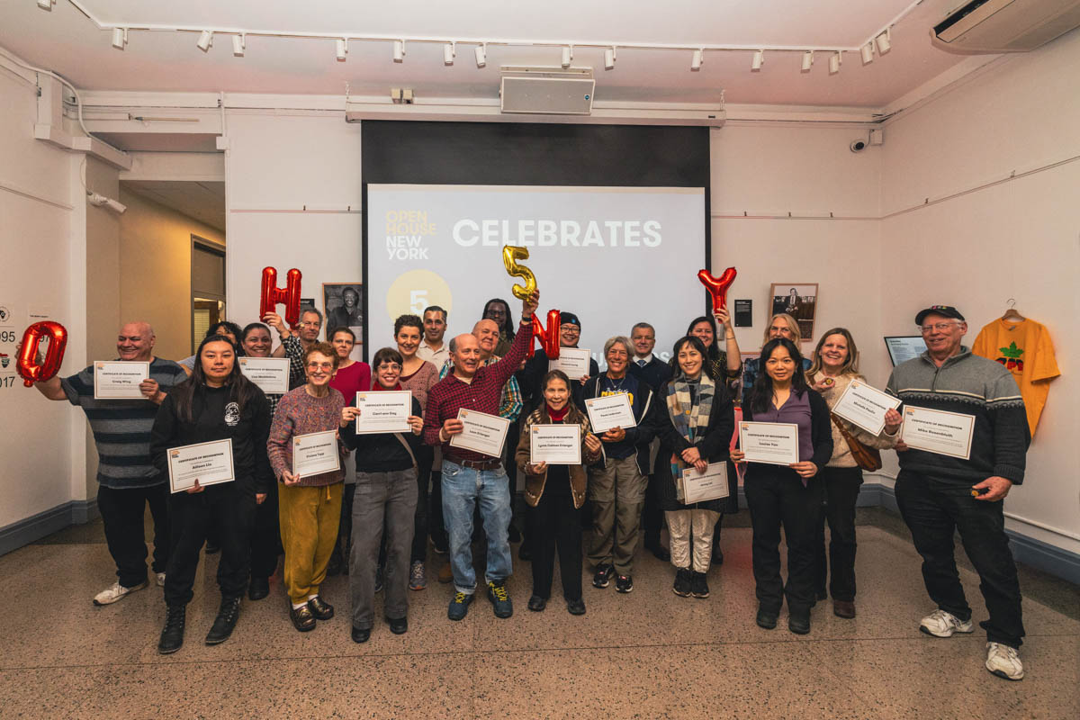 A group of people holding up balloons spelling out "OHNY 5"